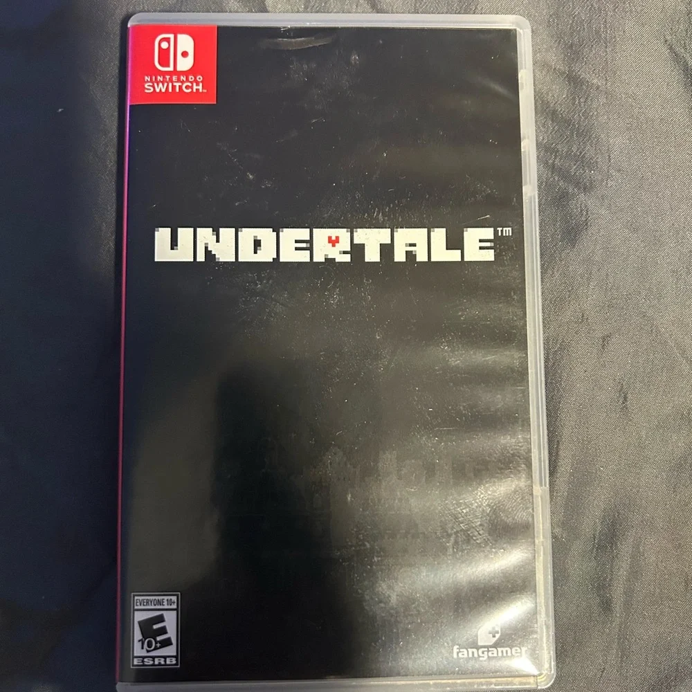 Nintendo Switch with gray Dock, Blue Kirby Case and Sonic Controller Accents,